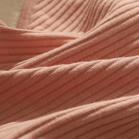 Tissu d'un slip rose en coton taille basse pour femme